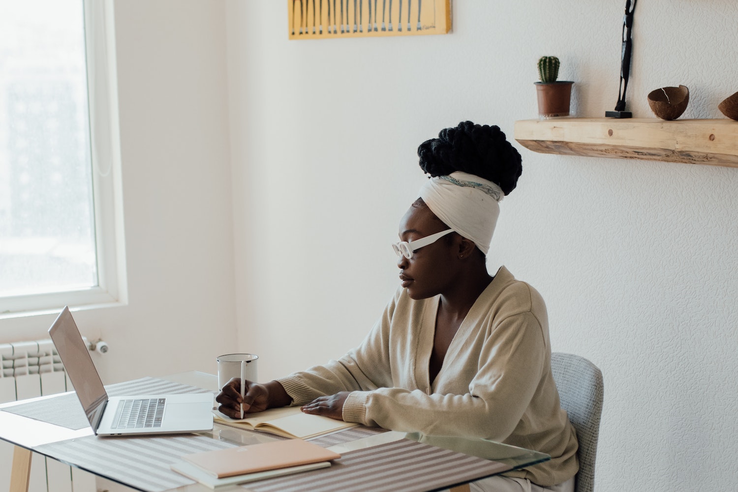 Black female solopreneur embodying all four qualities of a successful business owner
